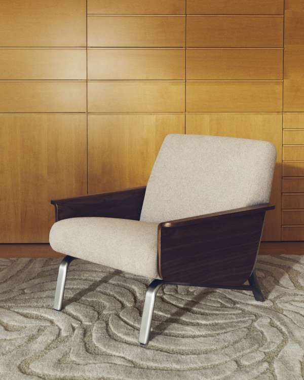 Amsen light brown armchair in walnut plywood with legs in brushed stainless steel
