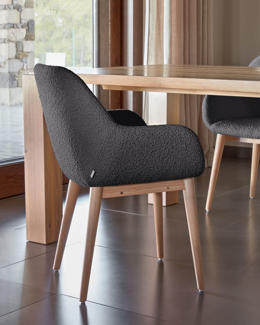 Konna chair in black bouclé with solid ash wood legs in a natural finish