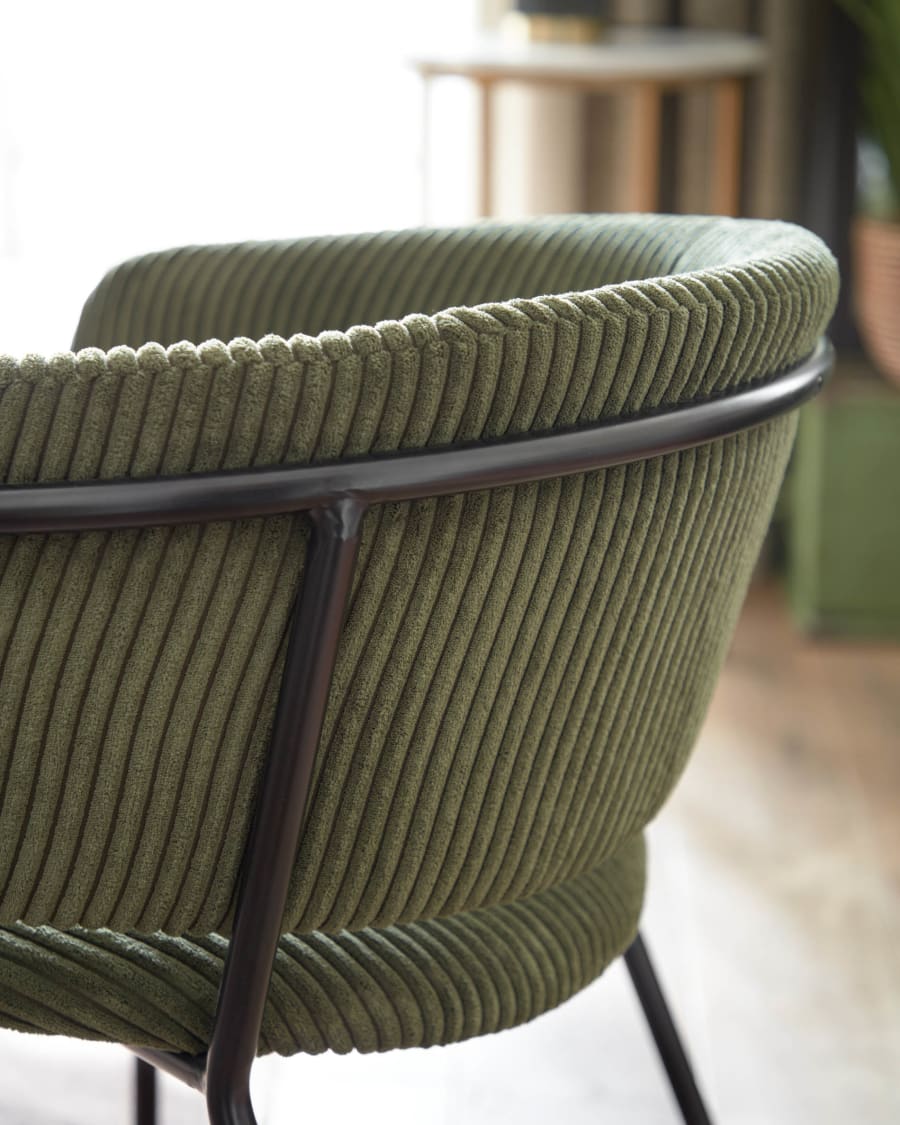 Runnie chair made from dark green wide seam corduroy and steel legs with black finish