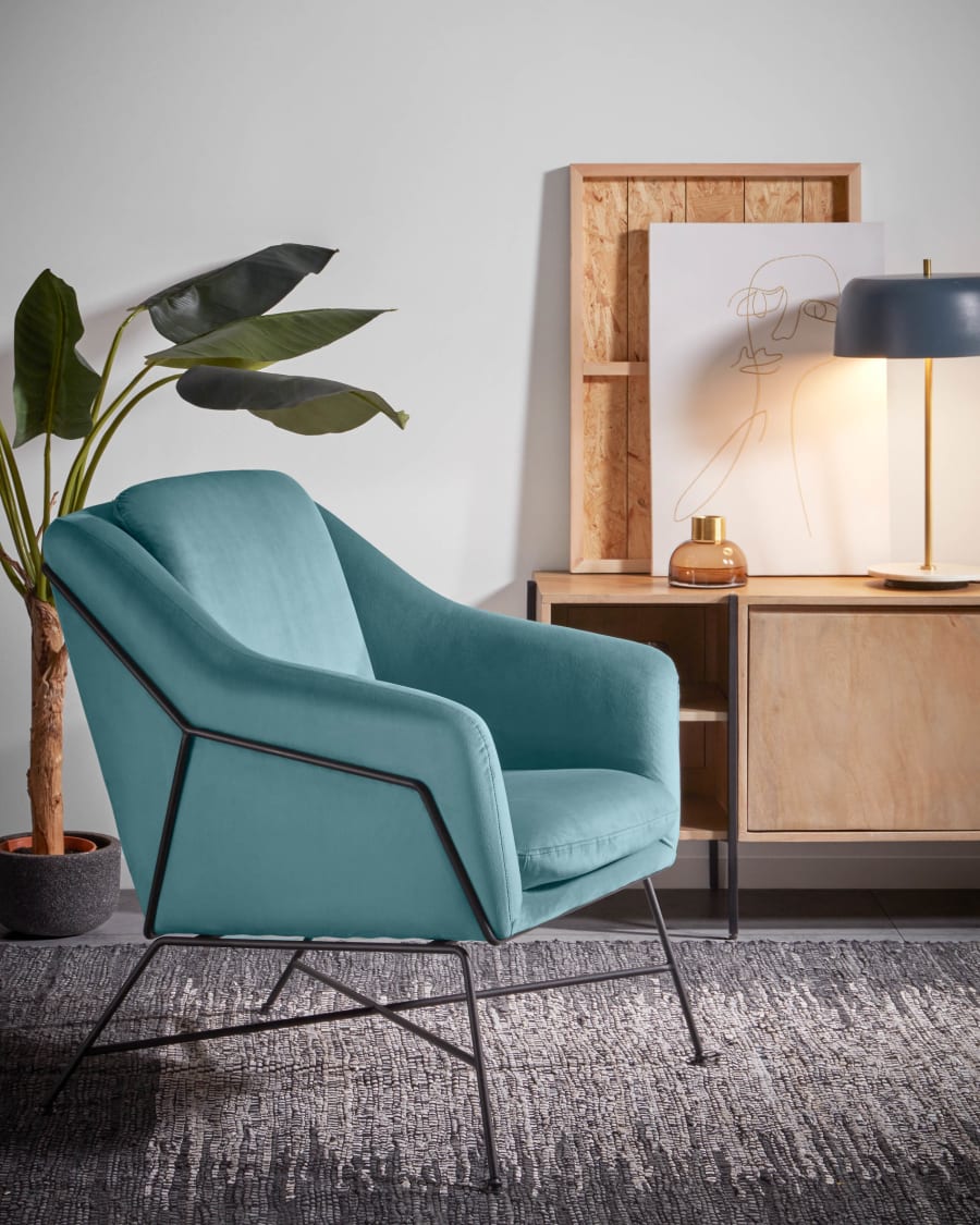 Brida velvet armchair in turquoise with steel structure in black finish.