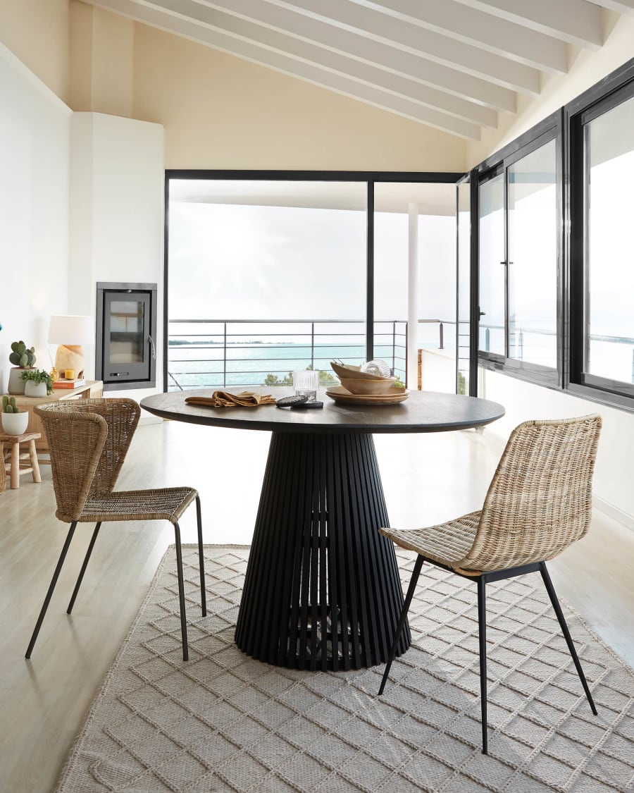 Equal chair made from rattan, with black finished steel legs