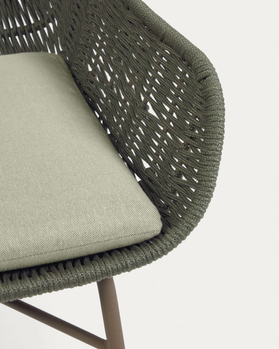 Abeli green cord armchair with galvanised steel legs.