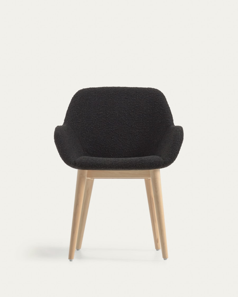 Konna chair in black bouclé with solid ash wood legs in a natural finish