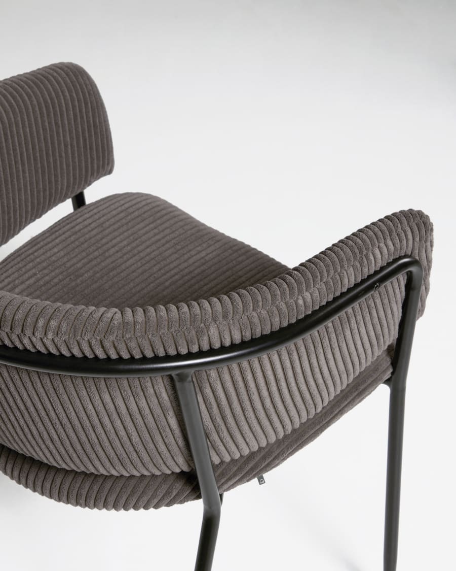 Runnie chair made from grey wide seam corduroy with steel legs in a black finish