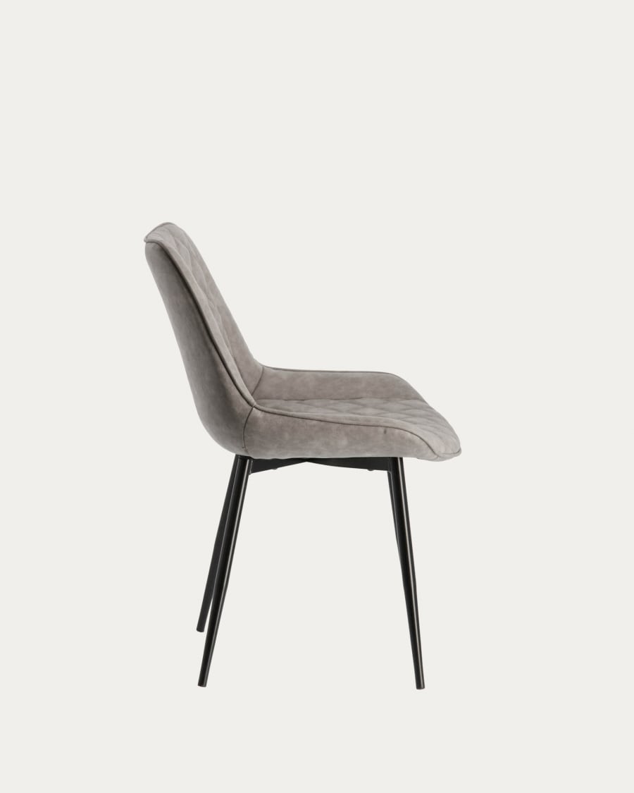 Adelia faux leather chair in light grey, with steel legs in a black finish.