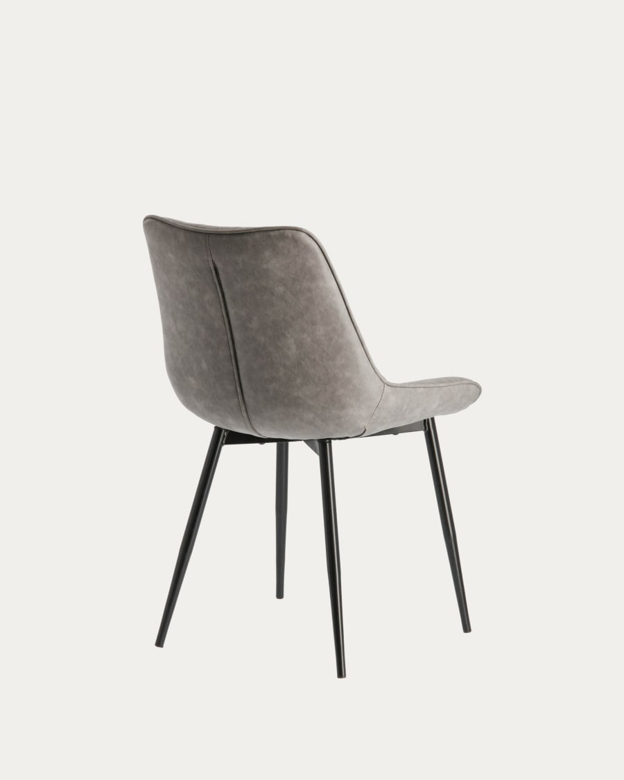 Adelia faux leather chair in light grey, with steel legs in a black finish.