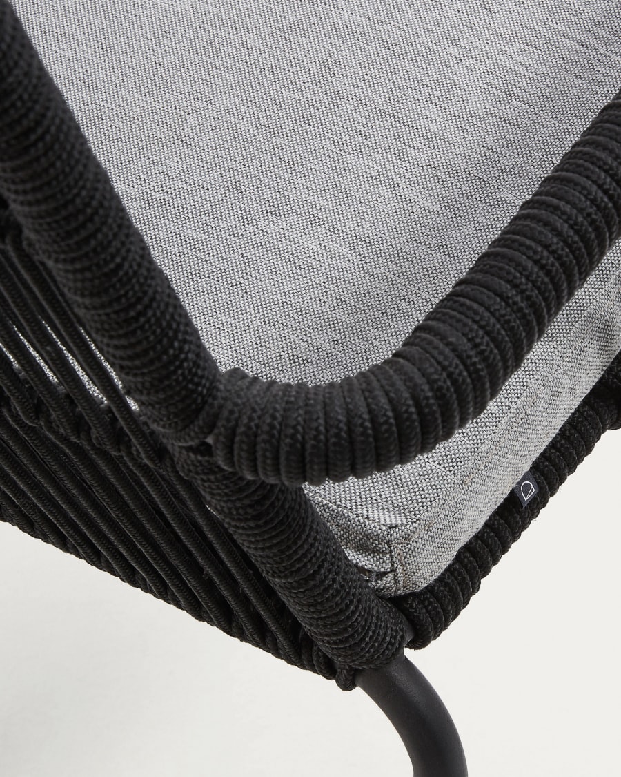 Samanta stackable chair made from black cord and galvanised steel legs.