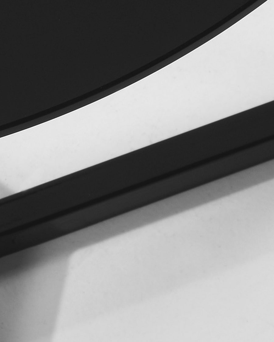 Black Raeam side table made with tempered glass and steel in black finish Ø 50 cm