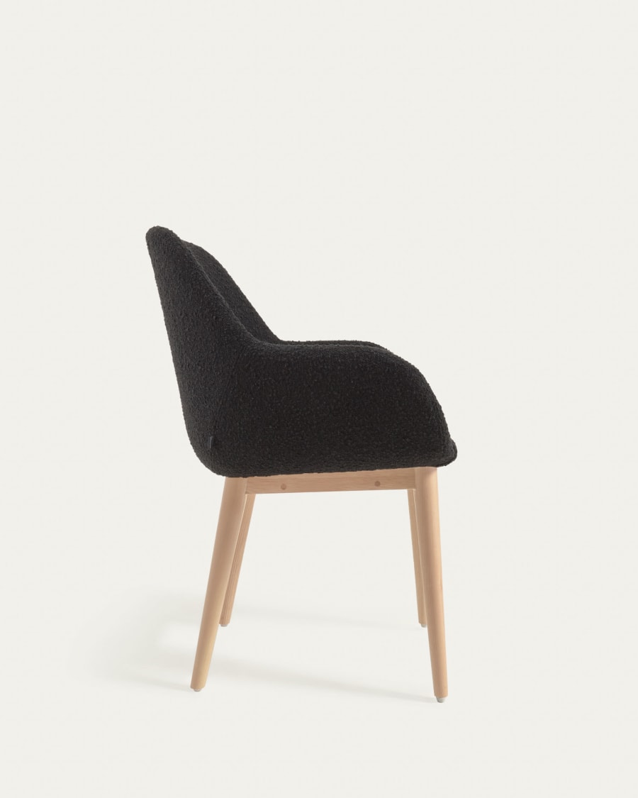 Konna chair in black bouclé with solid ash wood legs in a natural finish
