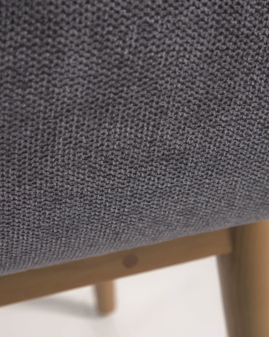 Konna chair in dark grey with solid ash wood legs in a dark finish
