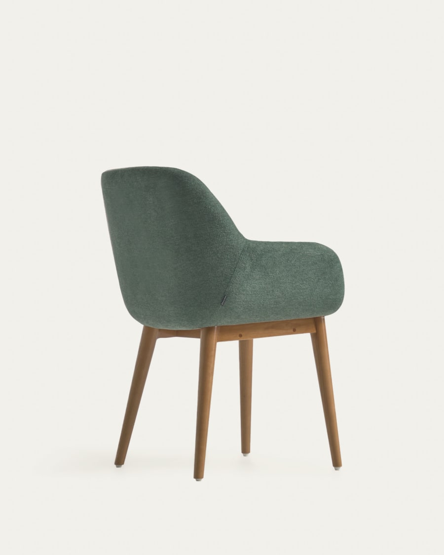 Konna chair in green with solid ash wood legs in a dark finish