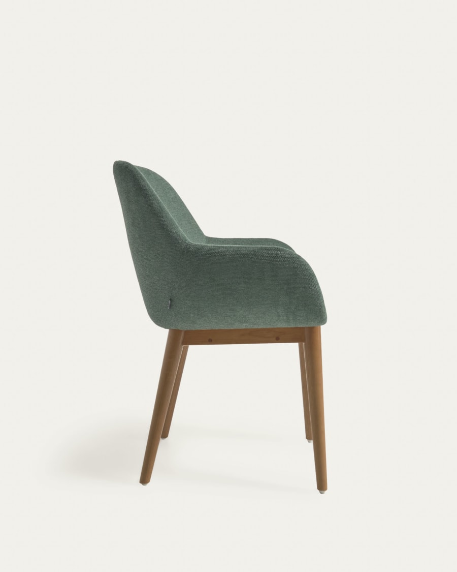 Konna chair in green with solid ash wood legs in a dark finish