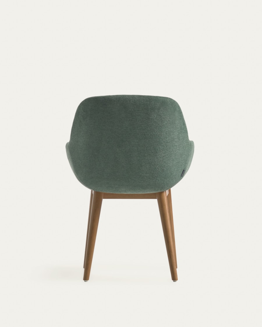 Konna chair in green with solid ash wood legs in a dark finish