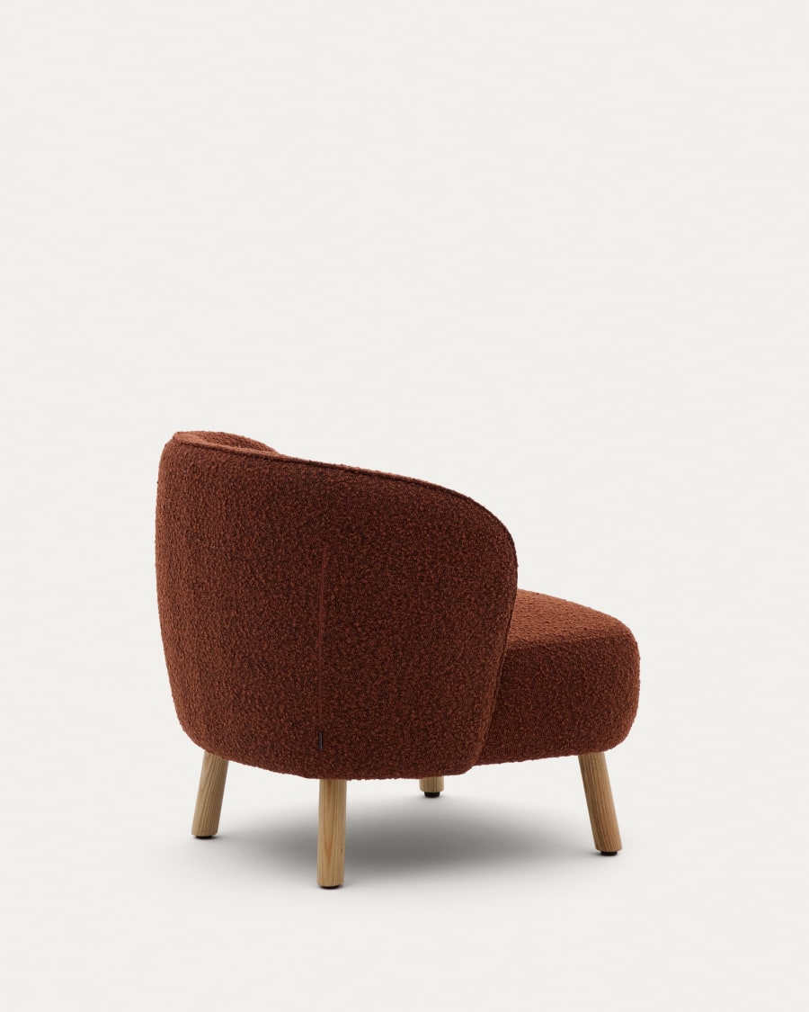 Ulit armchair in terracotta bouclé with solid beech wood legs in a natural finish