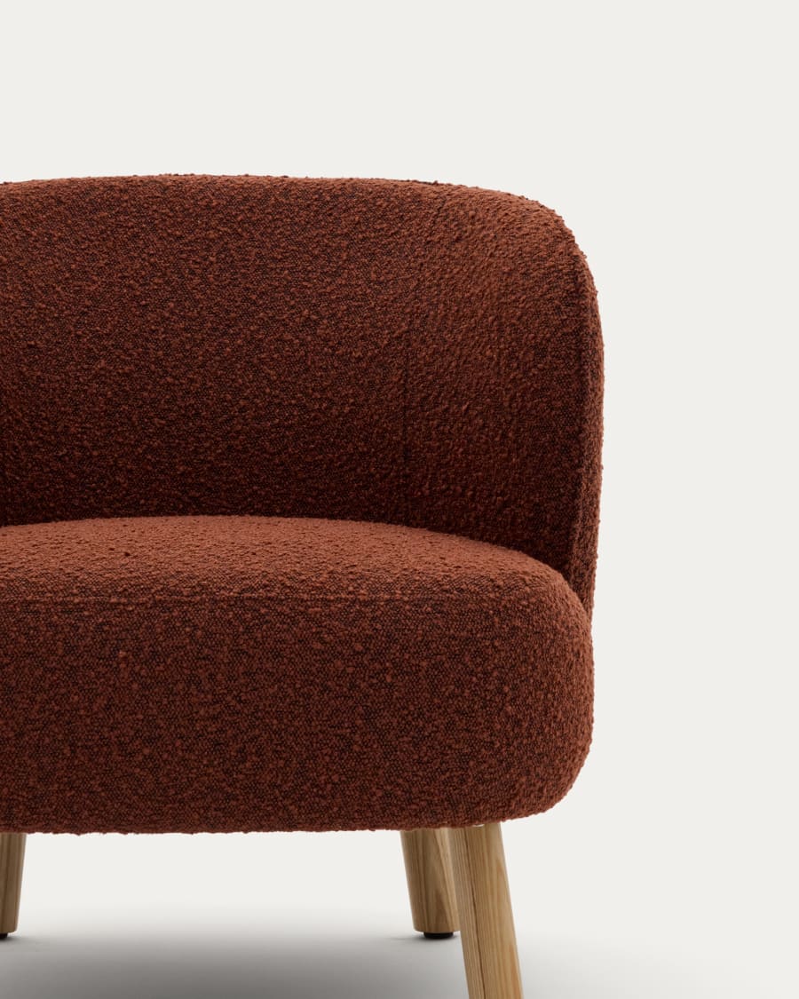 Ulit armchair in terracotta bouclé with solid beech wood legs in a natural finish