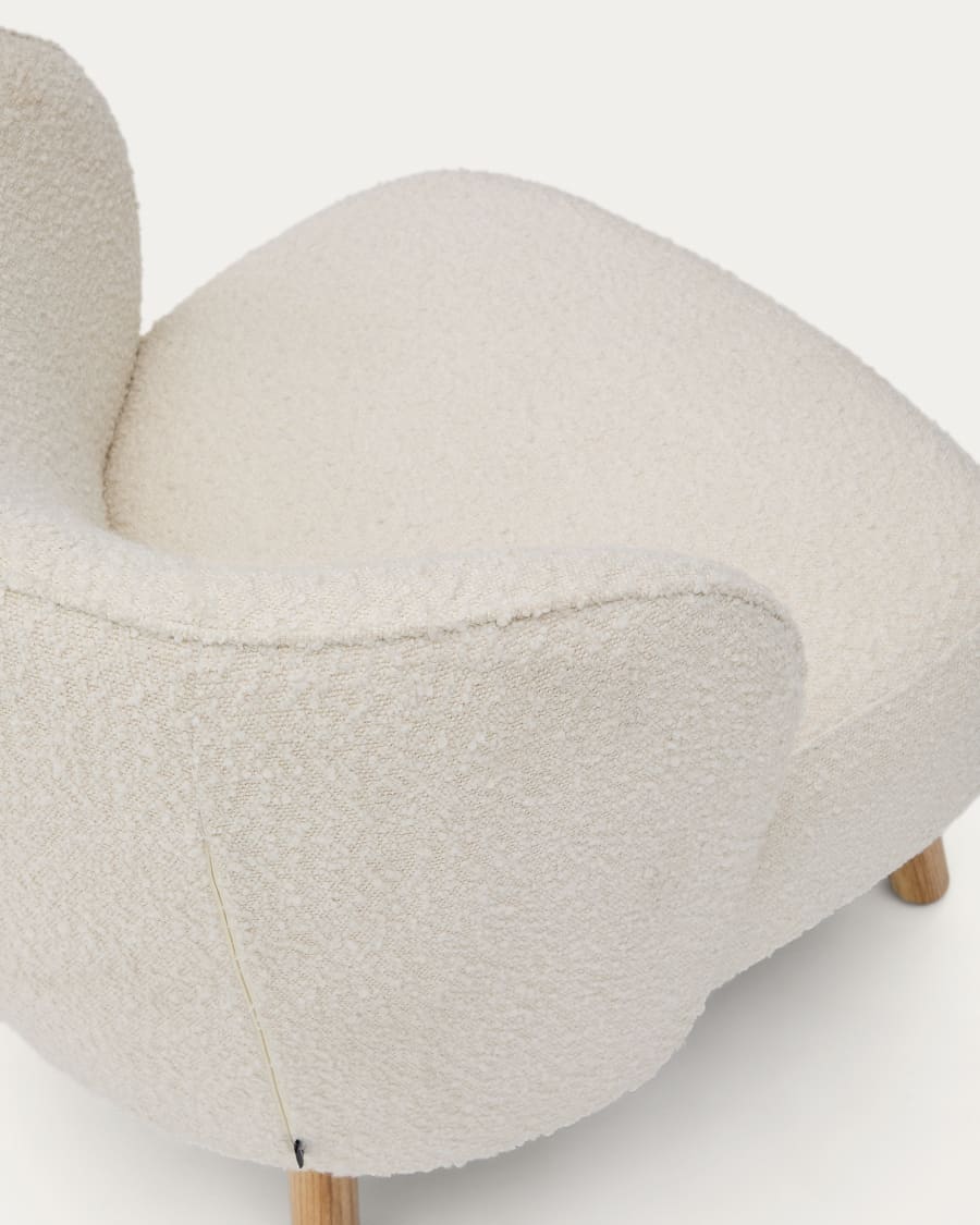 Ulit armchair in white bouclé with solid beech wood legs in a natural finish