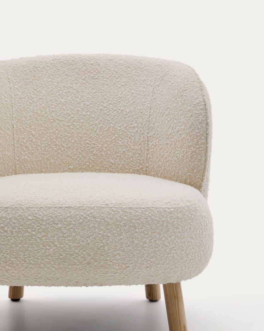 Ulit armchair in white bouclé with solid beech wood legs in a natural finish