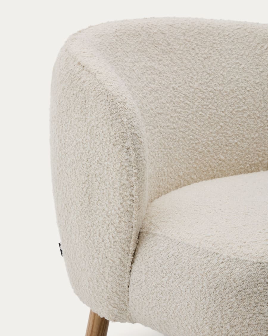 Ulit armchair in white bouclé with solid beech wood legs in a natural finish