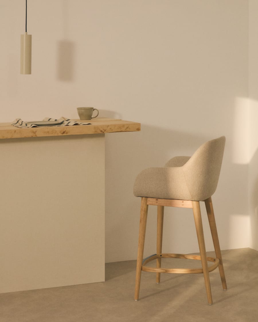 Konna stool in beige and solid ash wood legs in a light