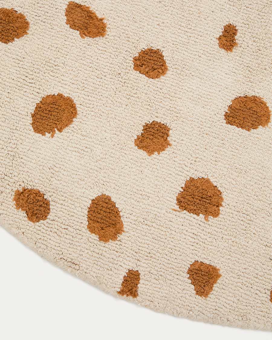 Tandani beige cotton round rug with orange cheetah design Ø 100cm