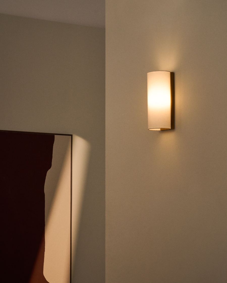 Umbran wall-mounted light fixture made from light brown rubberwood and beige linen