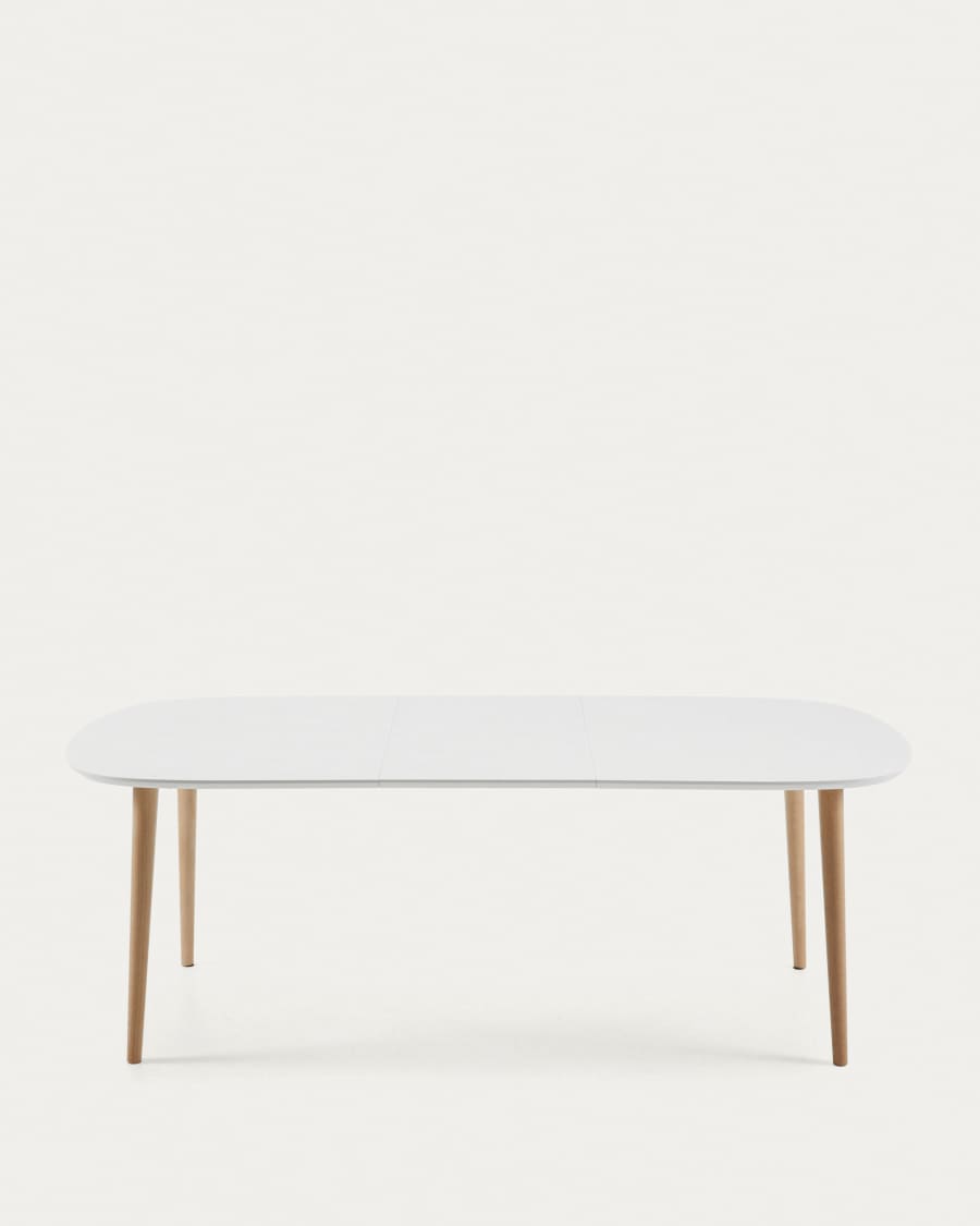 Oqui extendable oval table with an oak veneer and solid wood legs, Ø 160 (260) x 100 cm