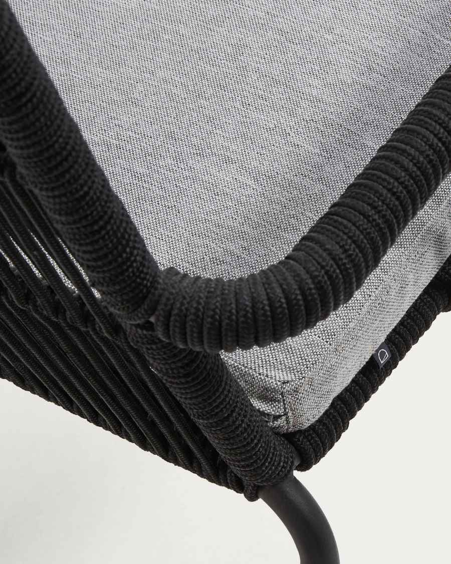 Samanta stackable chair made from black cord and galvanised steel legs.