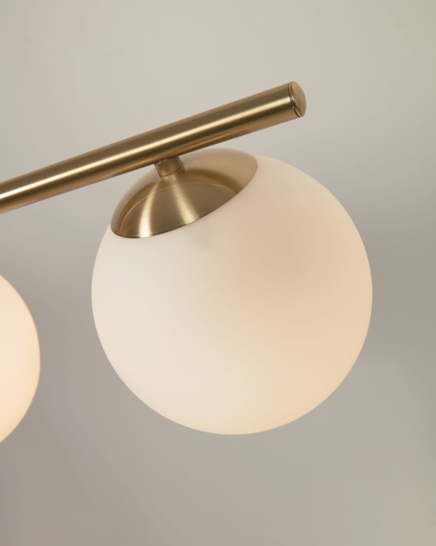 Mahala steel ceiling light with brass finish and three frosted glass spheres