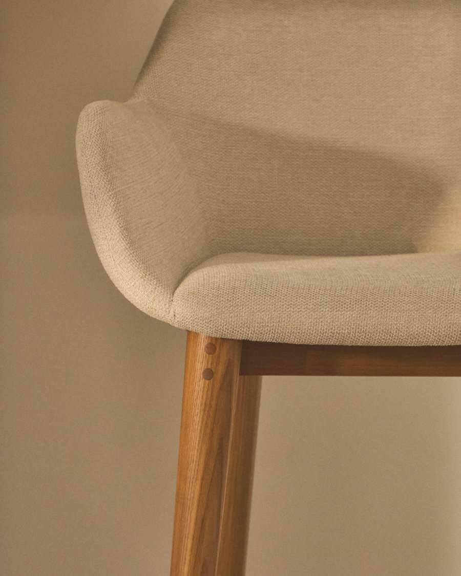 Konna stool in beige and solid ash wood legs in a dark finish, 65 cm