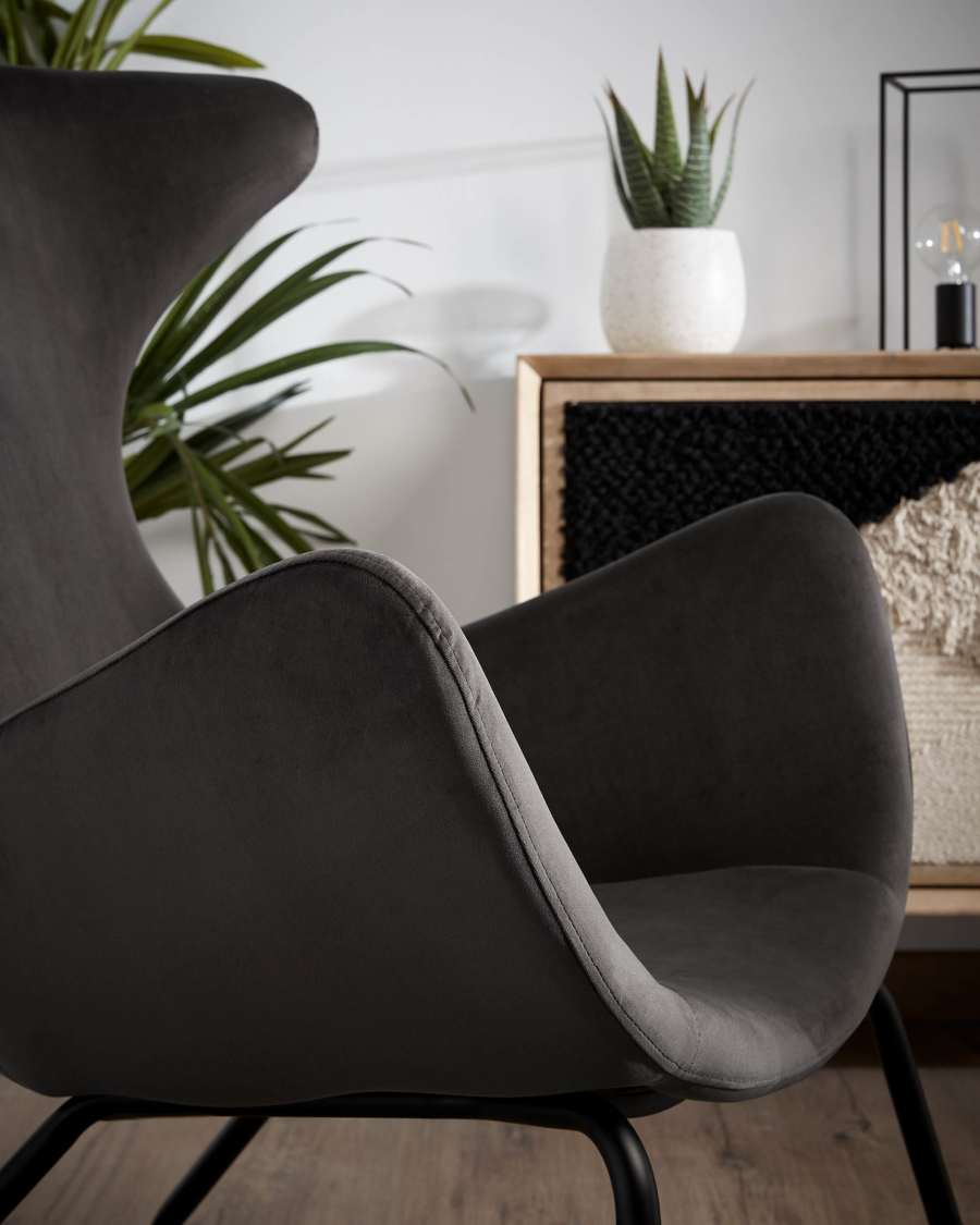 Chleo velvet armchair in grey with legs in a black finish.