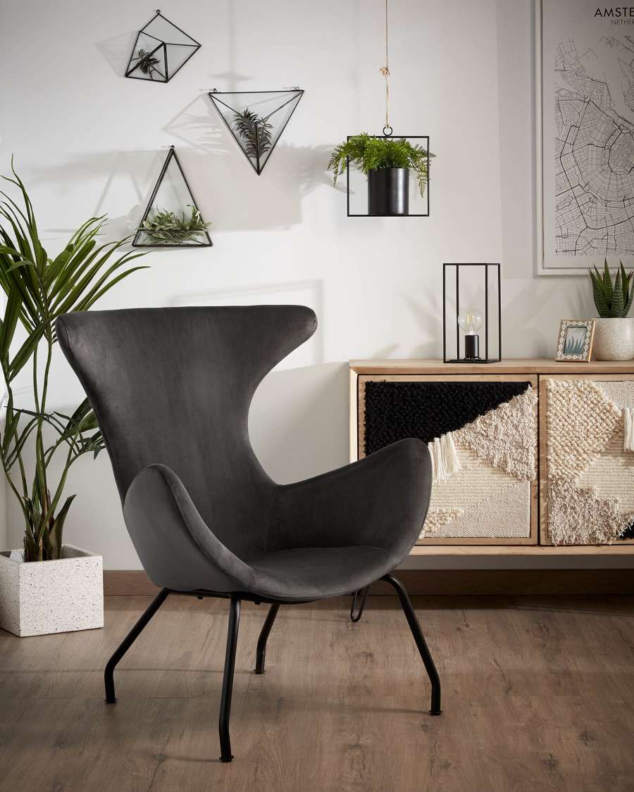 Chleo velvet armchair in grey with legs in a black finish.