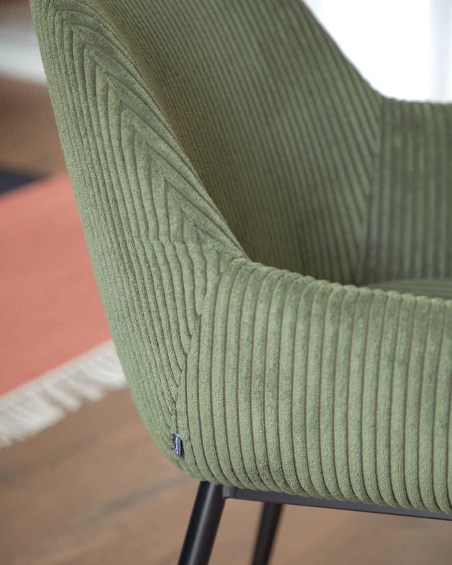Konna chair in dark green wide seam corduroy with steel legs and black painted finish