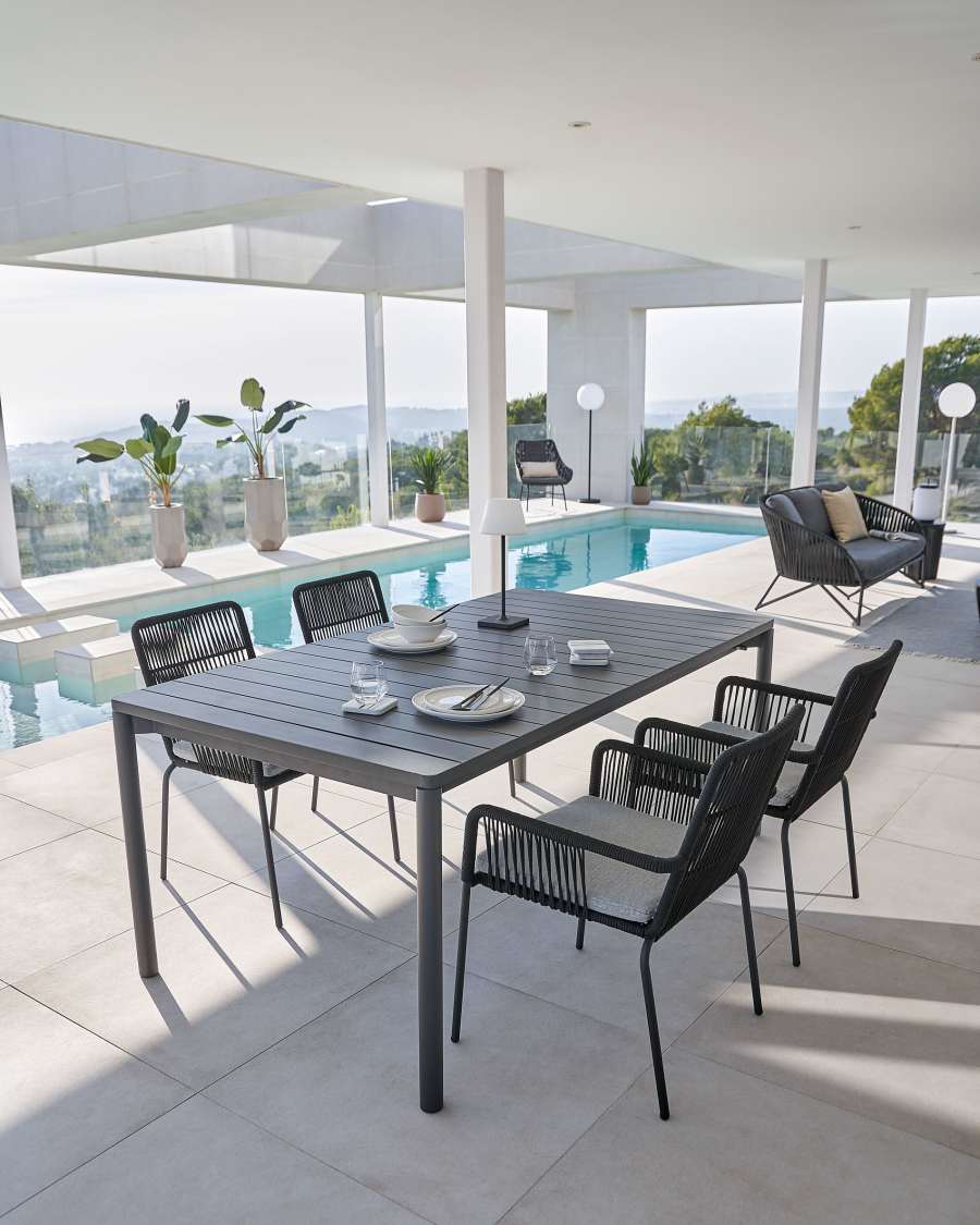 Samanta stackable chair made from black cord and galvanised steel legs.