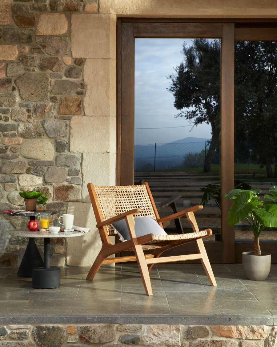 Delano grey terrazzo side table with steel legs in a black finish, Ø 55 cm