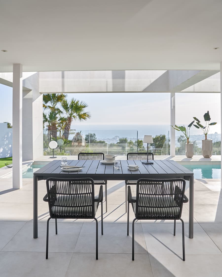 Samanta stackable chair made from black cord and galvanised steel legs.