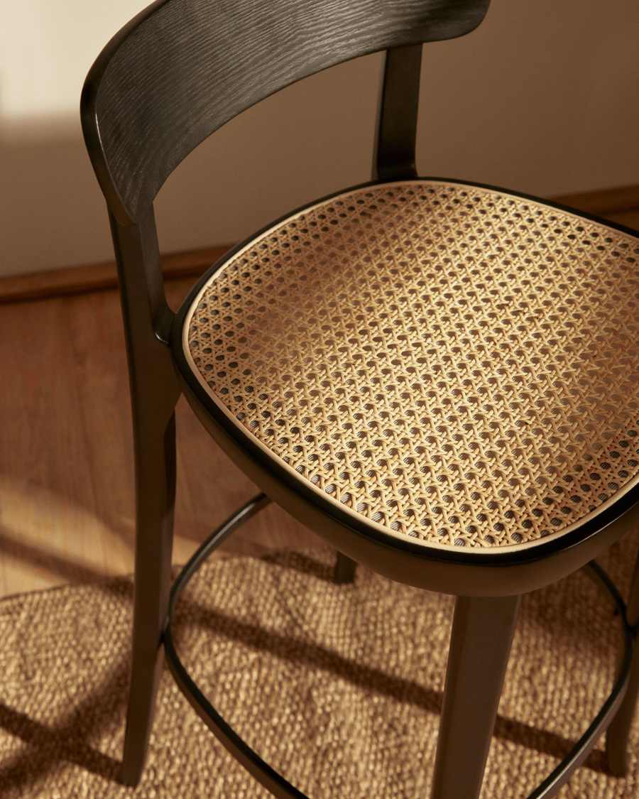 Romane beechwood stool with a black finish, ash wood veneer and ratan seat height 75 cm