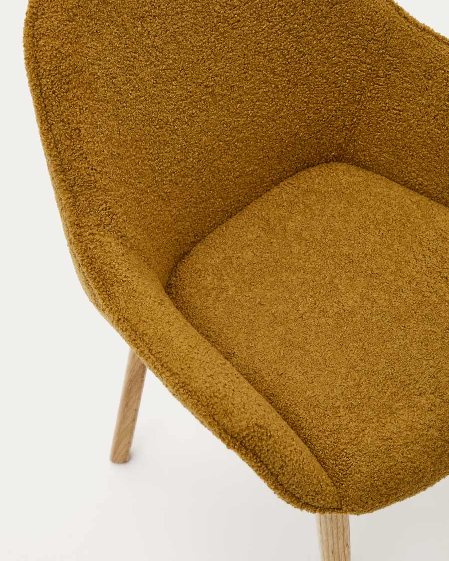 Aleli chair in mustard bouclé with solid ash wood legs and natural finish