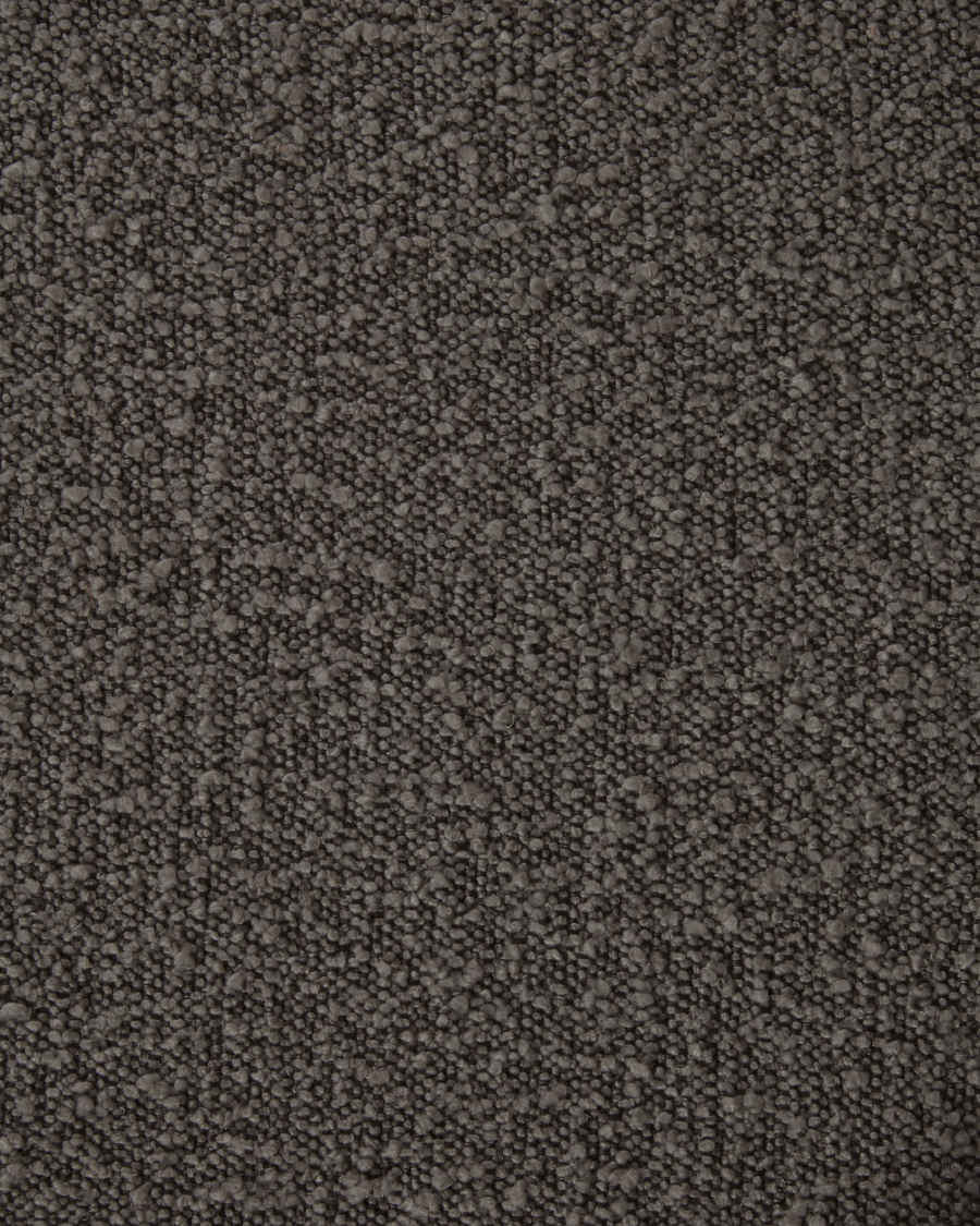 Stoel Aniela stoel van zwart bouclé en metalen poten met zwarte afwerking