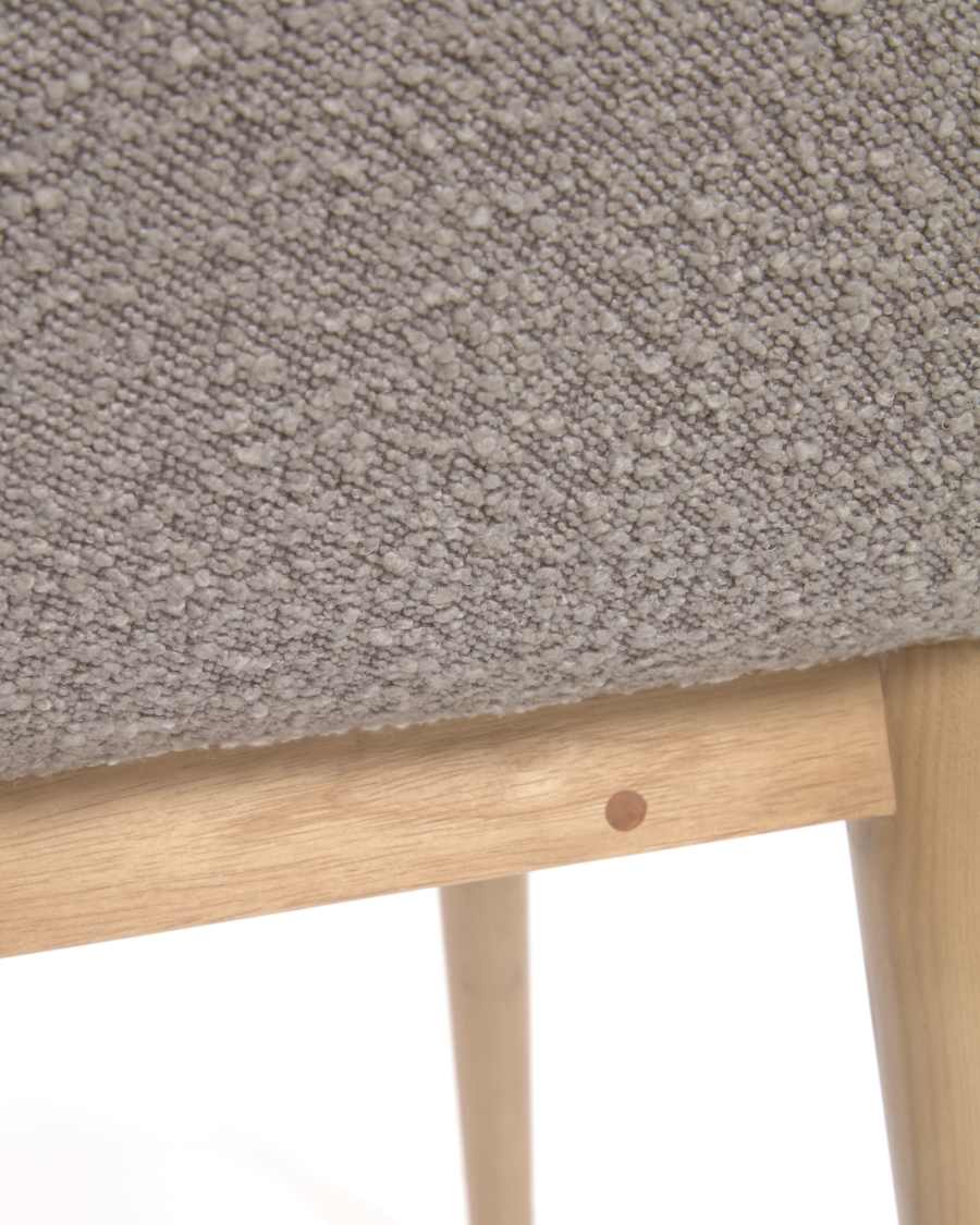 Konna chair in grey bouclé with solid ash wood legs in a natural finish