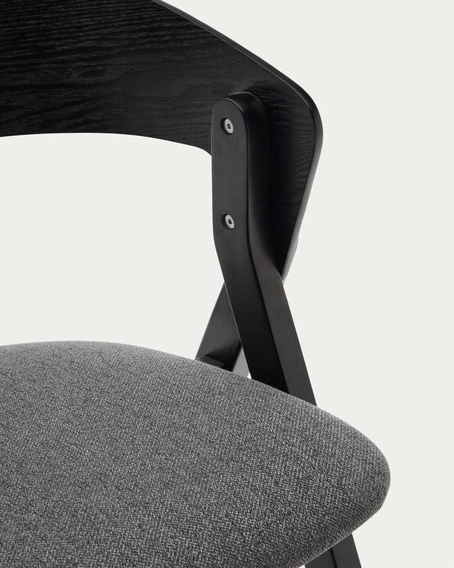 Godia chair in ash veneer with a black finish and grey chenille