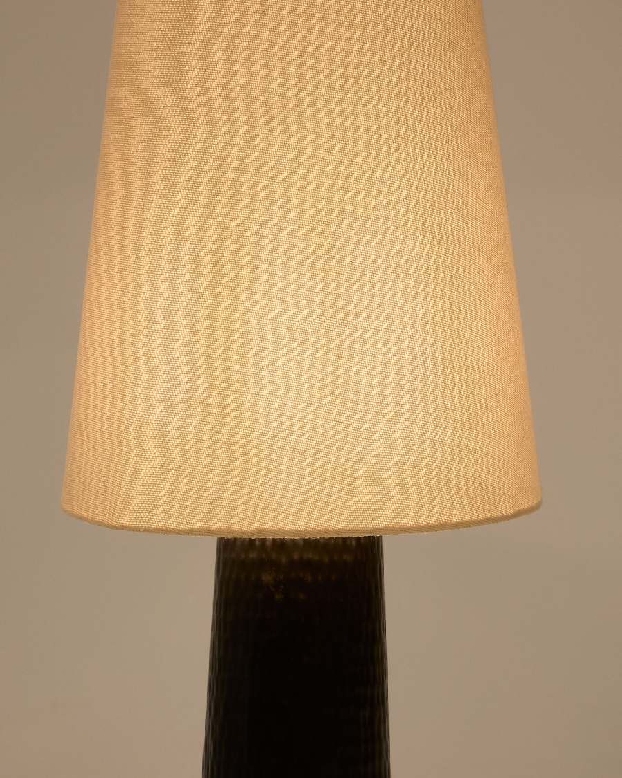 Senni floor lamp with a metal base in a black painted finish Australia adaptor