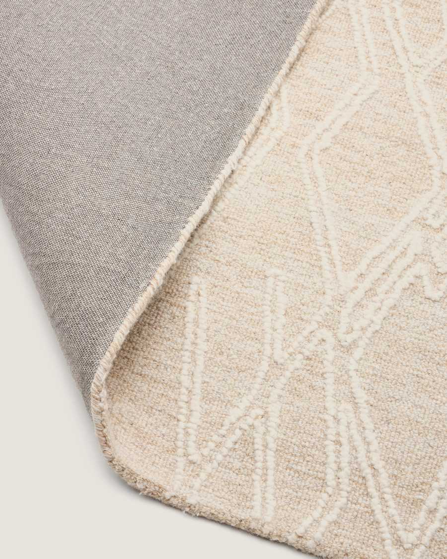Selira beige wool rug with embroidered effect 300 x 200cm
