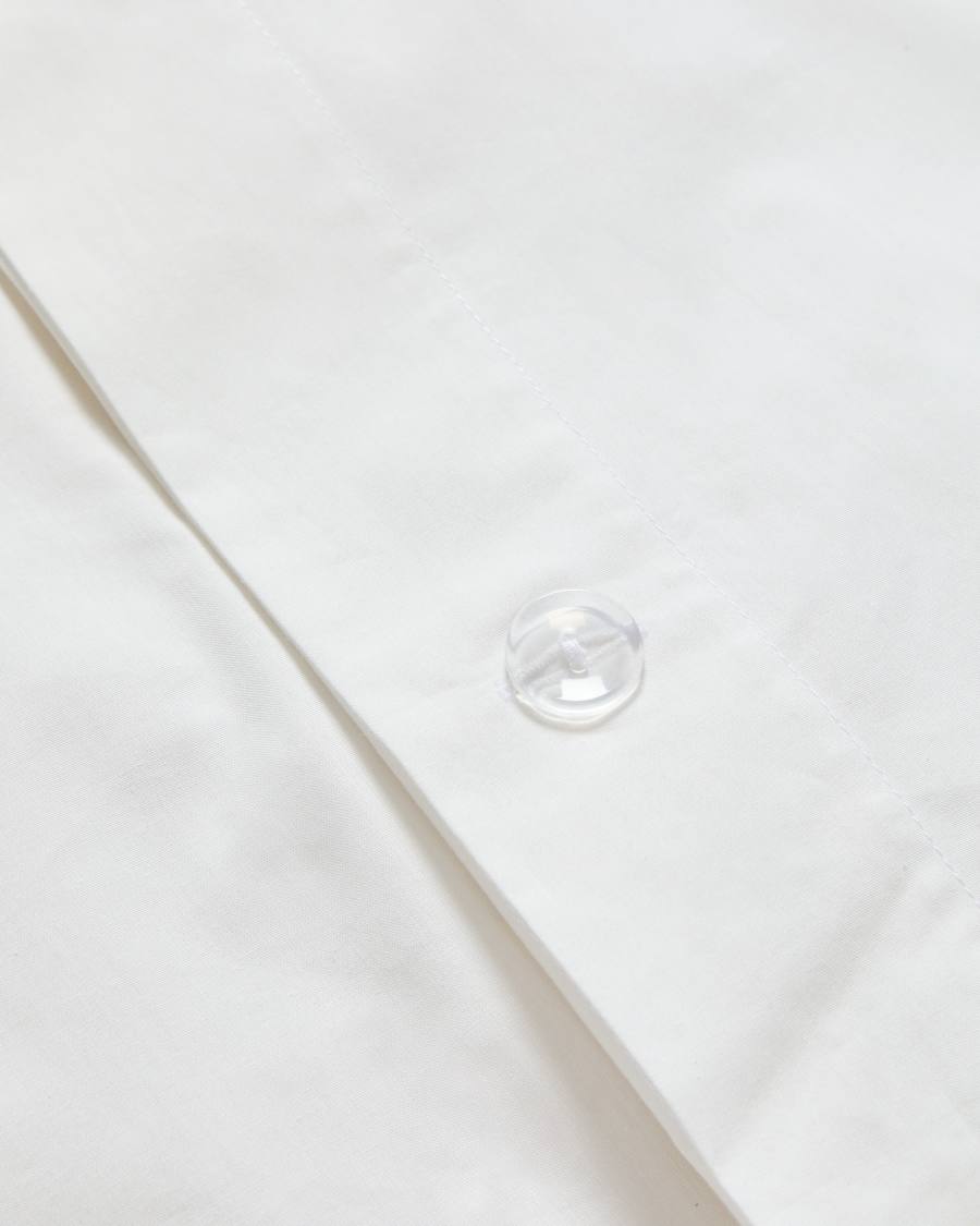 Ensemble Tandari housse de couette et taie d’oreiller en percale de coton beige avec broderie éléphant pour lit de 70 cm