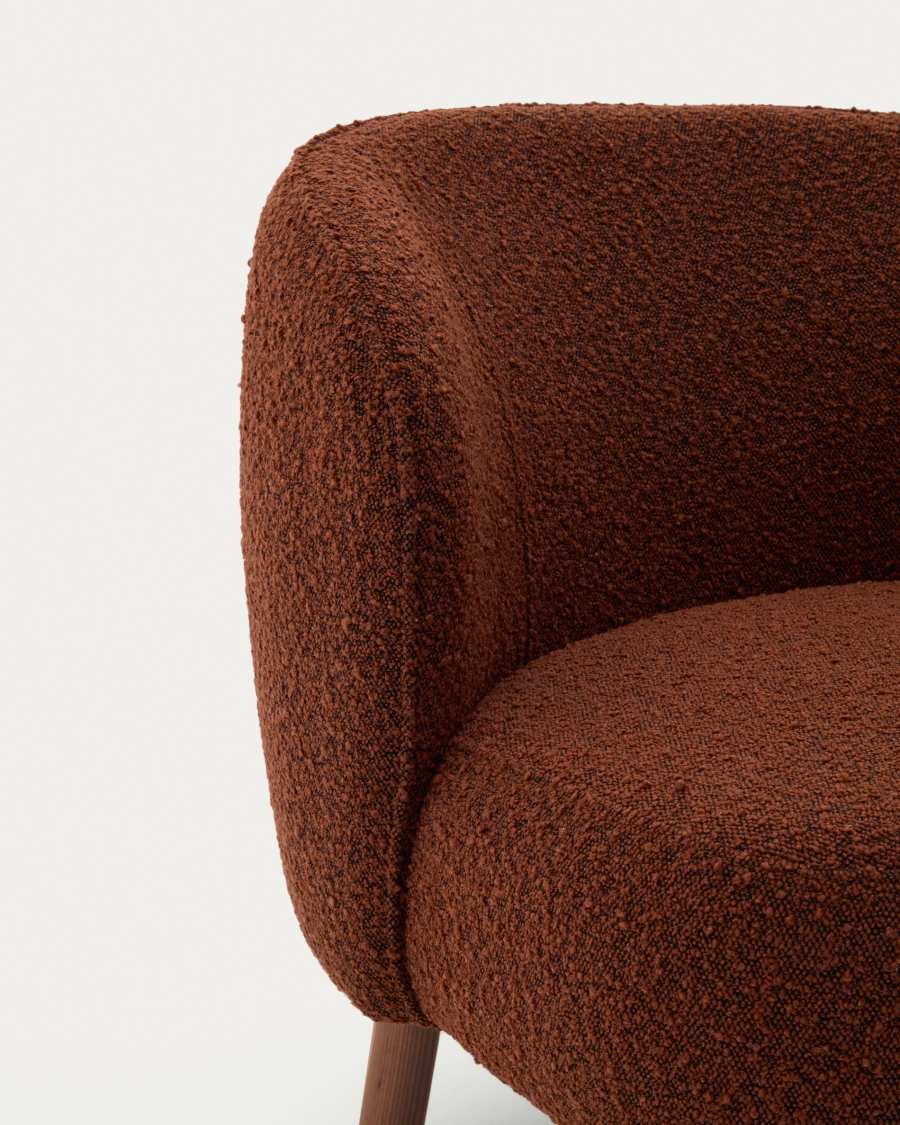 Ulit armchair in terracotta bouclé with solid ash wood legs in a walnut finish