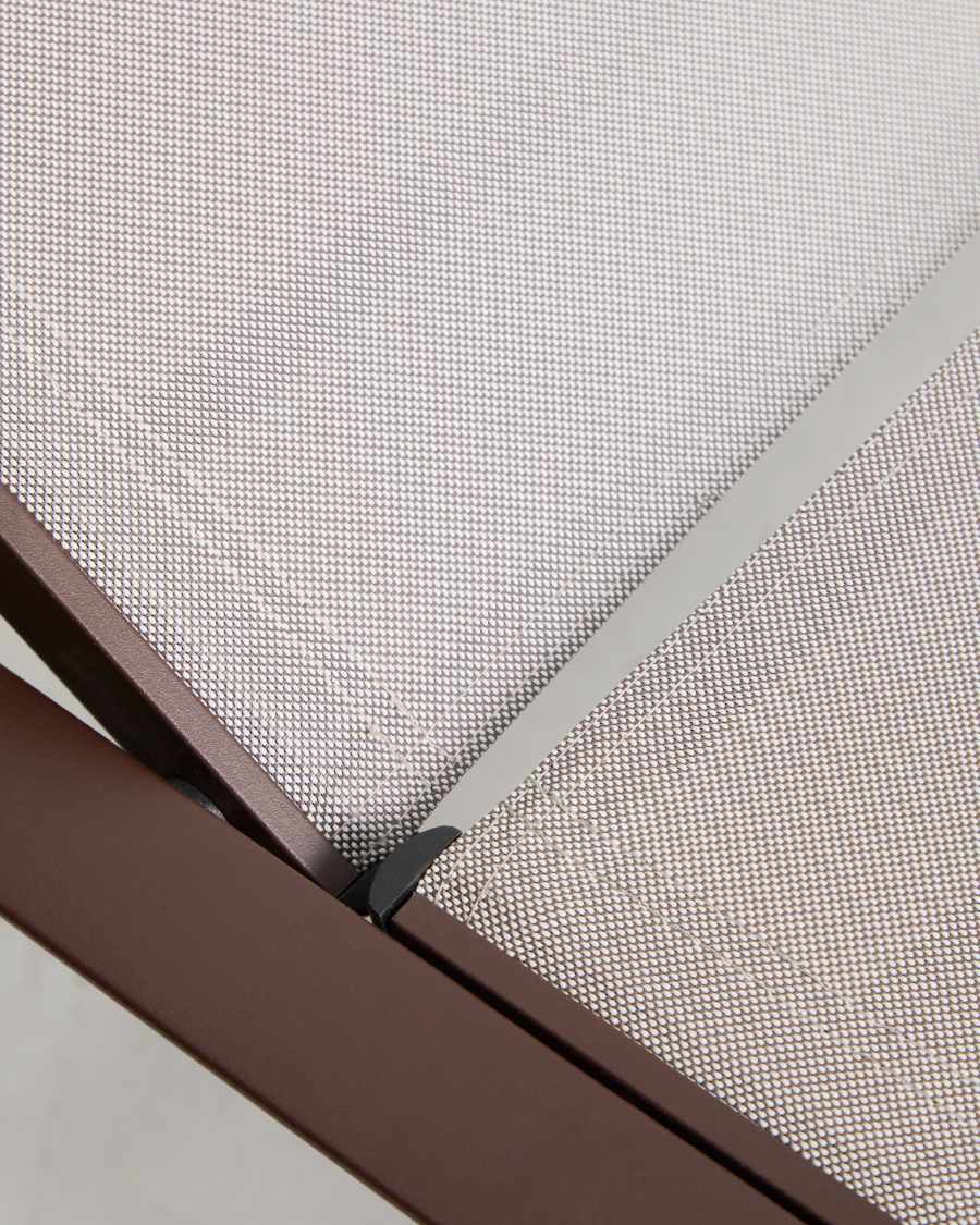 Stackable Capraia sun lounger in brown aluminium with light brown texteline