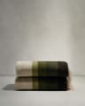 Voreni green recycled wool blanket with fringing 130 x 170cm