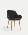Konna chair in black bouclé with solid ash wood legs in a natural finish